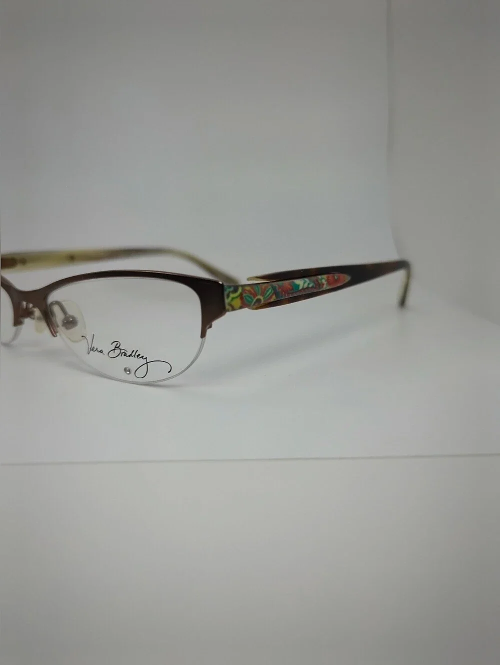 Lola. Vera Bradley Women's Semi-Rimless Glasses in Brown Matte. Small.